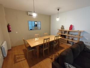 a living room with a table and a couch at Casa Laureana in Ruidera