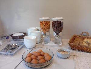 a counter topped with two blenders and a bowl of eggs at Bella Kaliva in Kalives Poligirou