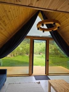 a view from the inside of a tent with curtains at Кольсай Тау Оректы resort in Kurmenty