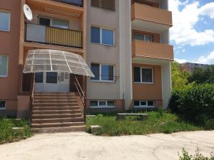 a building with a staircase in front of a building at APARTMÁN ROŽŇAVA city & parking in Rožňava