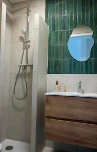 a bathroom with a shower and a sink at B&B Bistro Lochem in Lochem