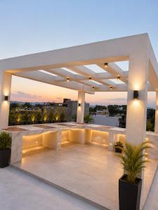 a large outdoor patio with a sunset in the background at CG Blue Horizon Villa in Vellore