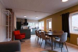 a dining room and kitchen with a table and chairs at Aurland Guesthouse in Aurland