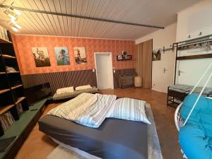 a room with a bed and a couch in it at Momo Den in Blomberg