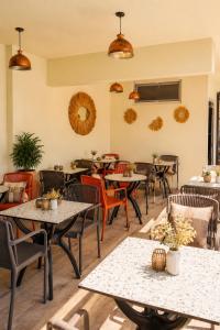 an empty restaurant with tables and chairs at Ciello Hotel Bodrum Adults Only 14 in Bodrum City