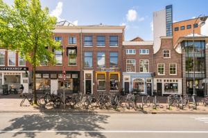a group of bikes parked in front of a building at Five Churches View apartments in Haarlem