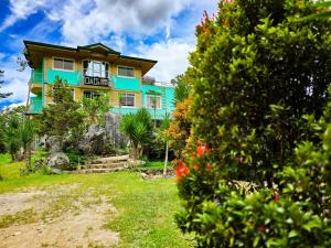 a house on top of a hill with a garden at 3 Mins Drive to Marlboro Hills - Sagada Dad's Homestay in Sagada +8 photos