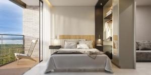 a bedroom with a bed and a balcony at Beach GAV Resorts in Salinópolis