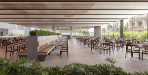 a rendering of a restaurant with tables and chairs at Beach GAV Resorts in Salinópolis