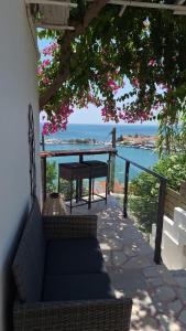 a view of the ocean from the porch of a house at OLYMPIADA View in Pythagoreio
