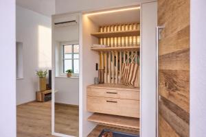 a room with a closet with a wooden dresser at Wiegehaus Retz in Retz