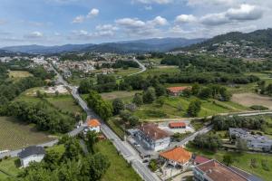 an aerial view of a small town with a road at Refugio Moderno as Portas do Geres in Ponte da Barca