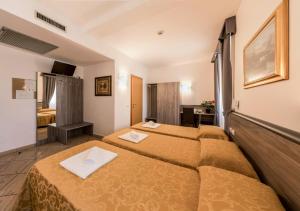 Vuode tai vuoteita majoituspaikassa Hotel Brianza