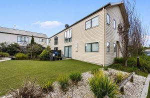 an exterior view of a house with a yard at The Cozy Corner Retreat in Port Sorell