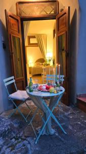 a table with candles on it in a room at The Nest & The Crest in Maratea +19 photos
