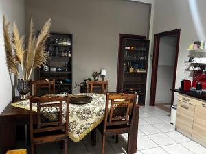 a dining room with a table and chairs at Vicente Apartment in Skala Rachoniou