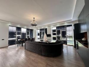 a large living room with a couch and a table at Peaceful Garden Villa in Gabala