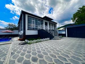 a small house with a blue and white at Peaceful Garden Villa in Gabala