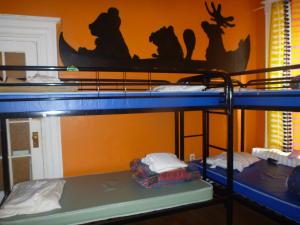 a group of bunk beds in a room at EKONO HOSTEL LA BELLE PLANETE BACKPACKERS Downtown Quebec City in Quebec City