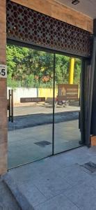 a sliding glass door of a building with a street at micro 3 in Volta Redonda +12 photos