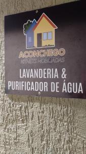 a sign for a house on the side of a building at Loft Moderno 1 in Volta Redonda +13 photos