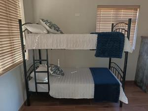 a couple of bunk beds in a room at Cape Karoo Lodge in Riversdale +5 photos