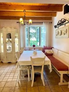 a dining room with a white table and chairs at Tre Bujtinat Gjinar in Elbasan +53 photos