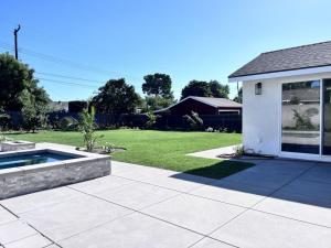 a backyard with a pool and a house at Beautiful Home with 4 bedroom, 2 bathrooms-full amenities in Orange