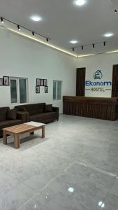 a living room with couches and a coffee table at Econom Hostel Ganja in Ganja