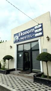 a building with a sign for a hospital at Econom Hostel Ganja in Ganja