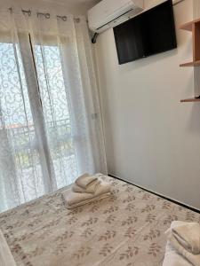 a room with a bed with a towel on it at Casa Vacanze Scilla in Scilla