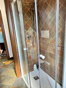 a shower with a glass door in a bathroom at Casa Vacanze Scilla in Scilla