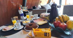 a table topped with breakfast foods and orange juice at Paradise In Coffee in Socorro +15 photos