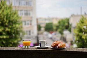 a breakfast of coffee and croissants and a glass of orange juice at Centralsquad in Mangalia
