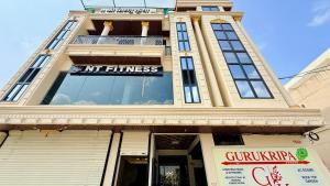 a building with a sign on the front of it at Hotel Gurukripa in Harsola