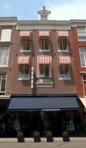 a large brick building with a cross on top of it at Hotel Bellington in Amsterdam