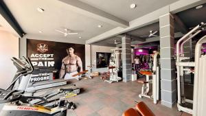 a gym with a poster on the wall at Hotel Gurukripa in Harsola