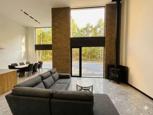 a living room with a couch and a table at White Chalet Niseko in Niseko