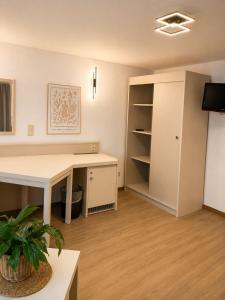 an office with a desk and a book shelf at MiTi Sleep and Go in Bernkastel-Kues