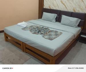 a bed in a room with at Theglassystay in Raipur