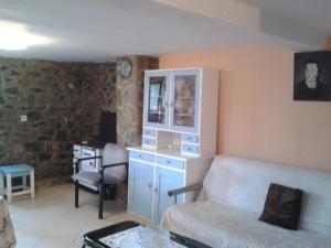 a living room with a couch and a table at Do Vuceljica in Andrijevica