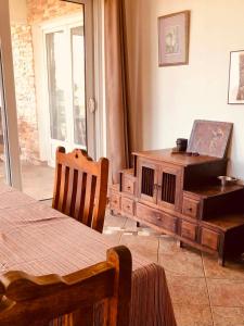 a bedroom with a wooden dresser and a wooden table at A house with the view in Bar