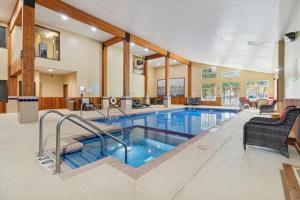 a swimming pool in a house with a swimming pool at Wyndham Garden Madison Fitchburg in Madison