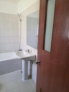 a bathroom with a sink and a mirror at C7 double up in Camama +11 photos