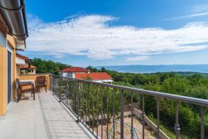 a balcony with a view of the mountains at Holiday house Gloria in Vrbnik