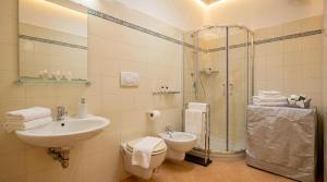 a bathroom with a toilet and a sink and a shower at Casa della Marina - beach, seaview, wifi in Conca dei Marini +9 photos