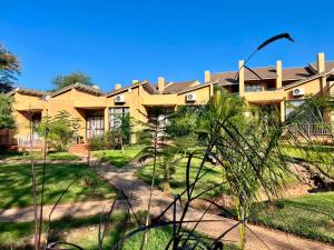 an exterior view of a large house at Wild View Resort in Kasane