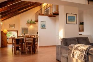 a living room with a couch and a table at Villa Belvedere Amodeo - terrace, seaview, wifi in Conca dei Marini