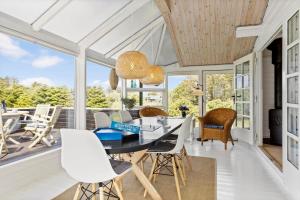 a dining room with a table and chairs at LN1926-Hjorring-Jollevej-2 in Hjørring +31 photos
