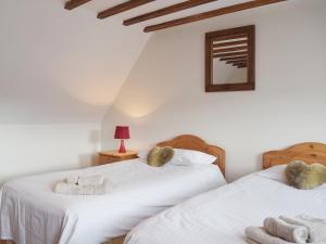 two beds in a bedroom with towels on them at Chive - E4326 in Catfield +4 photos